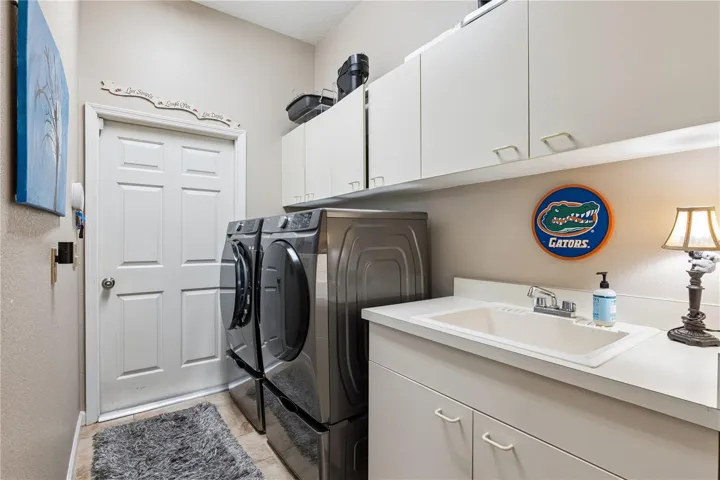 Laundry Room with sink and cabinetry