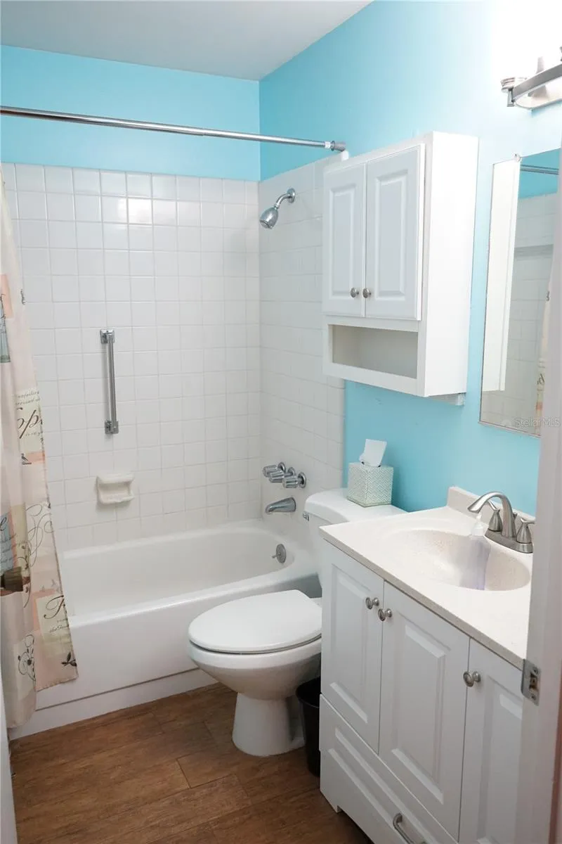 hall bath has tub-shower combo