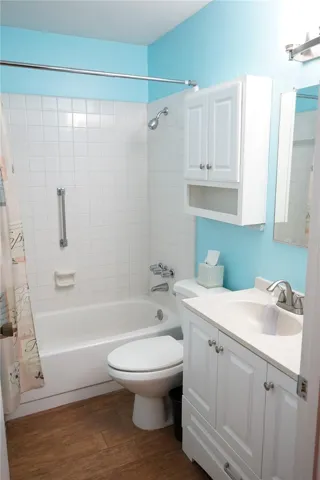 hall bath has tub-shower combo