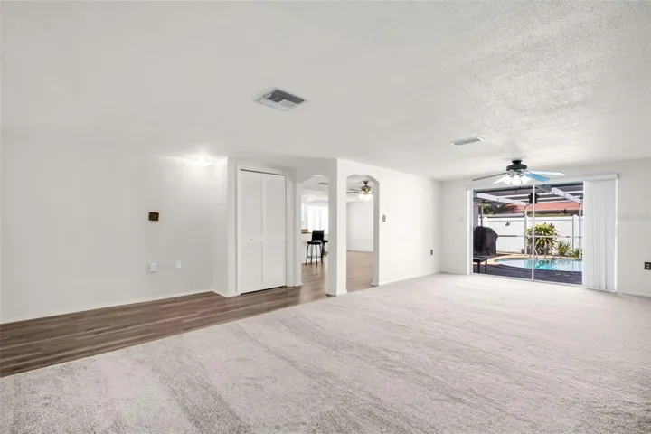 Living room and formal Dining room with access to the pool.