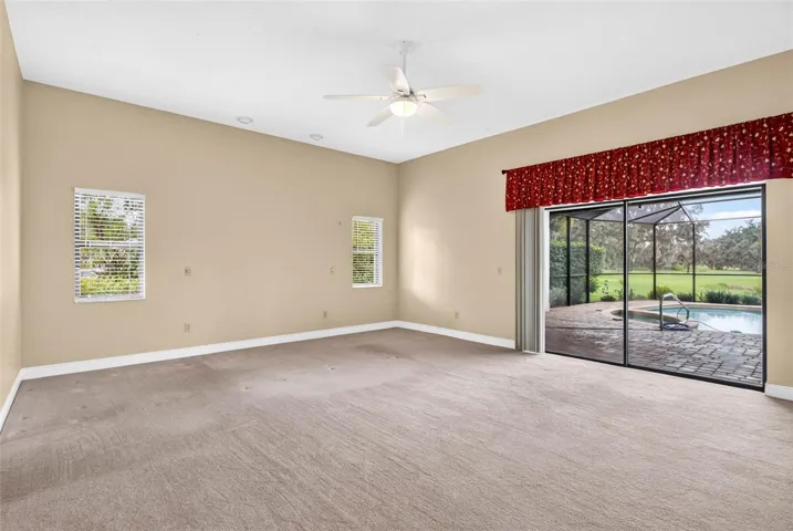 Primary bedroom with pocket sliders to pool