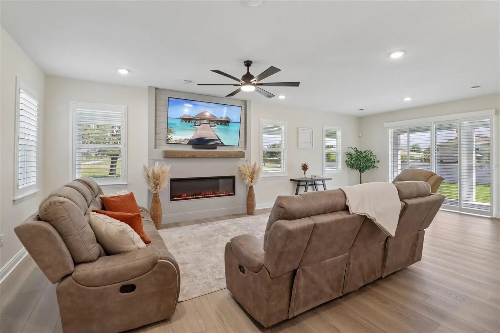 The generous living area is complete with feature fireplace.