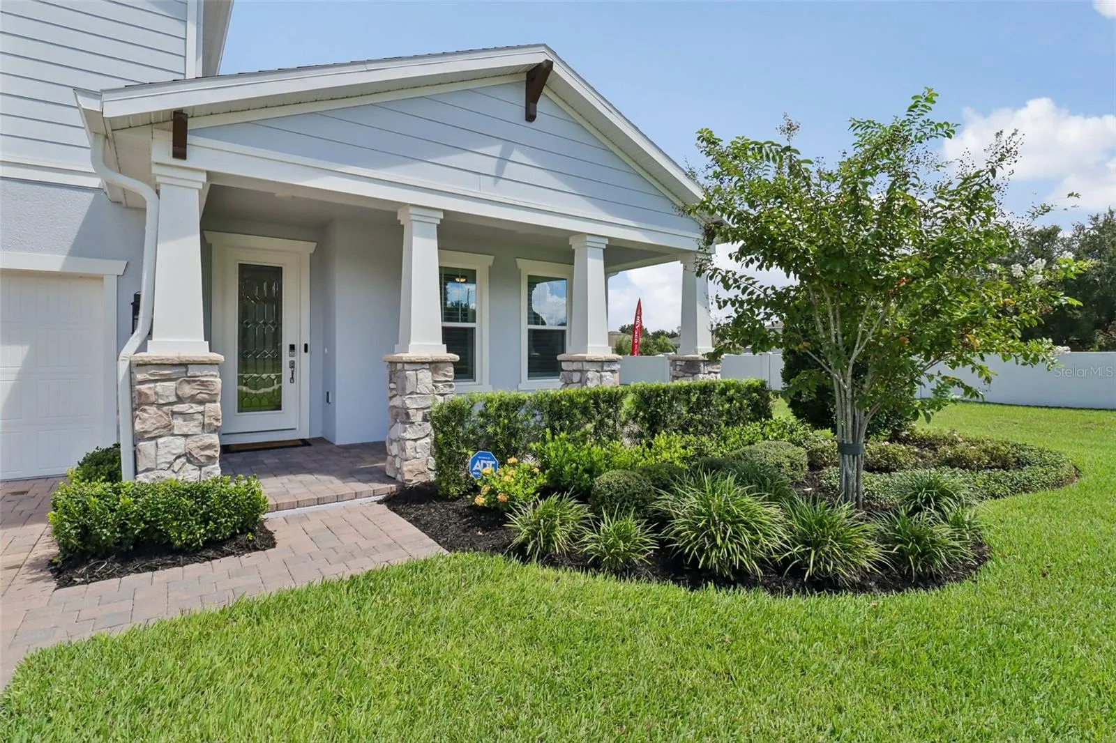 Manicured front entry, covered front porch.