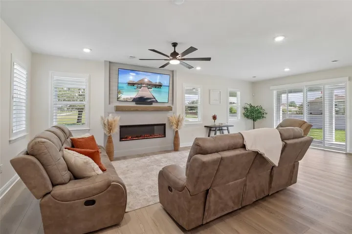 The generous living area is complete with feature fireplace.