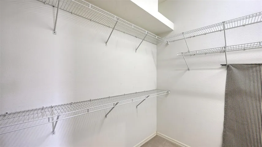 Large walk in closet in primary suite