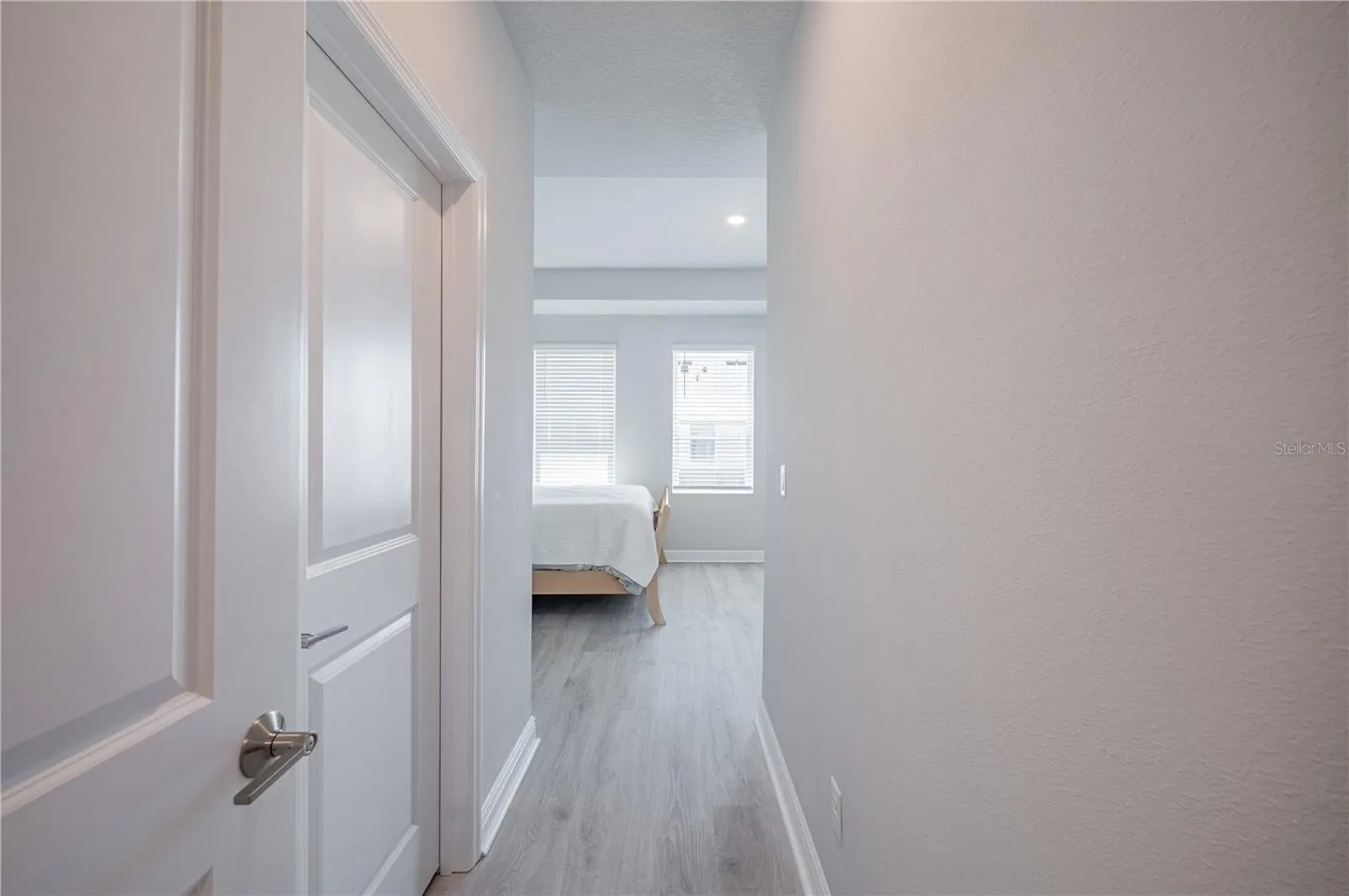 Entering primary suite. Walk-in closet on left.