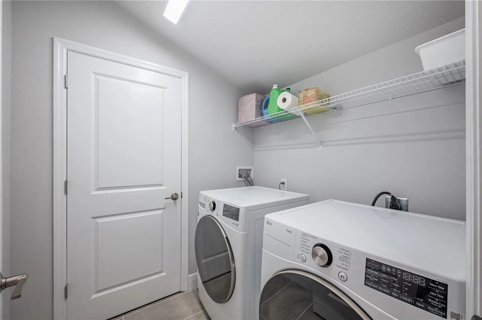 Full washer &amp; dryer and air handler in far closet.