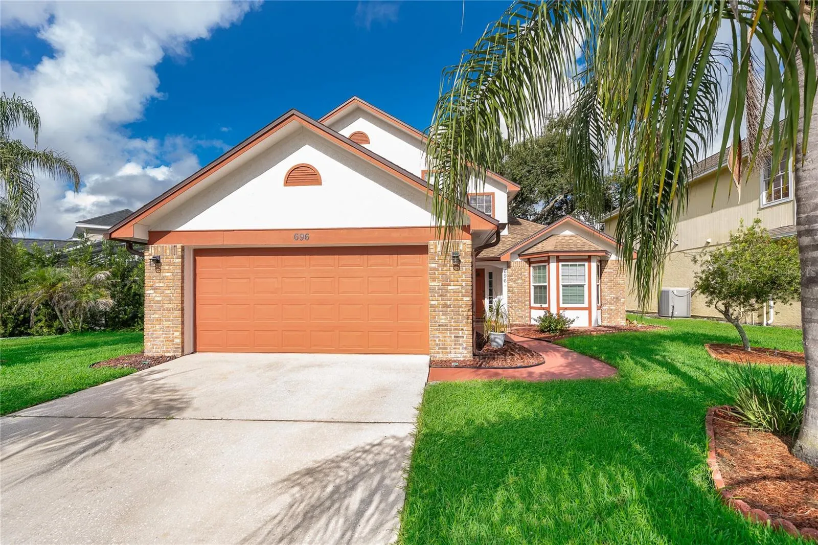 Large Driveway + 2-Car Garage