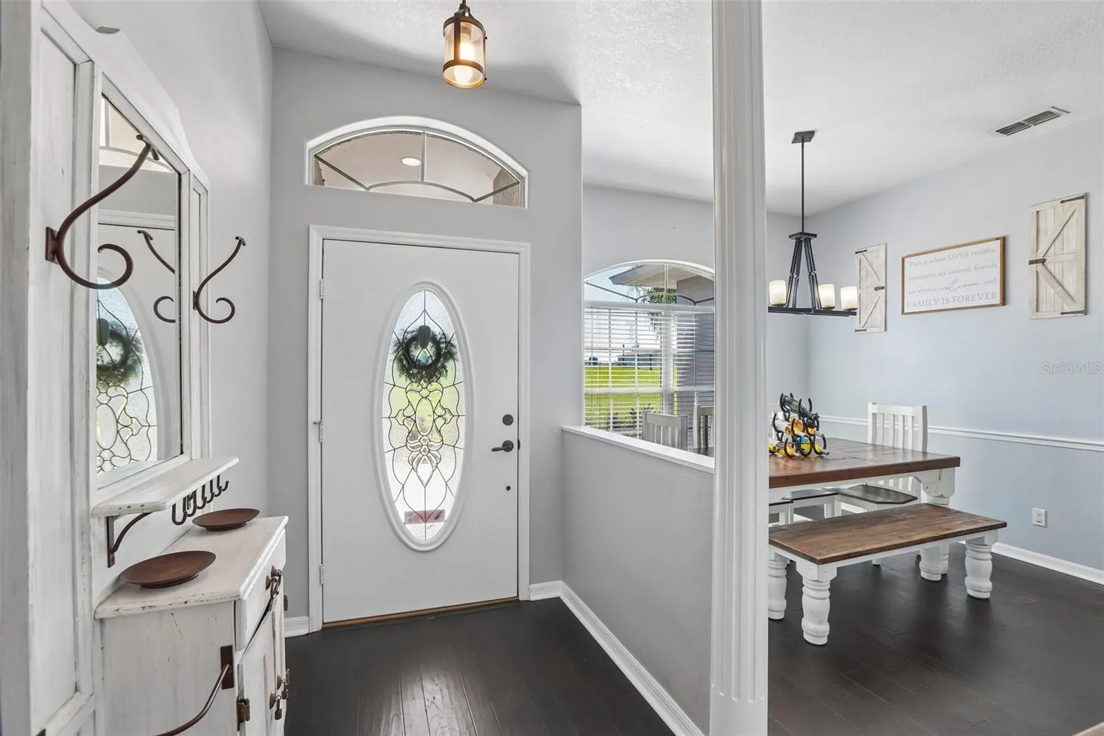 Foyer with view to the frond door and dining room