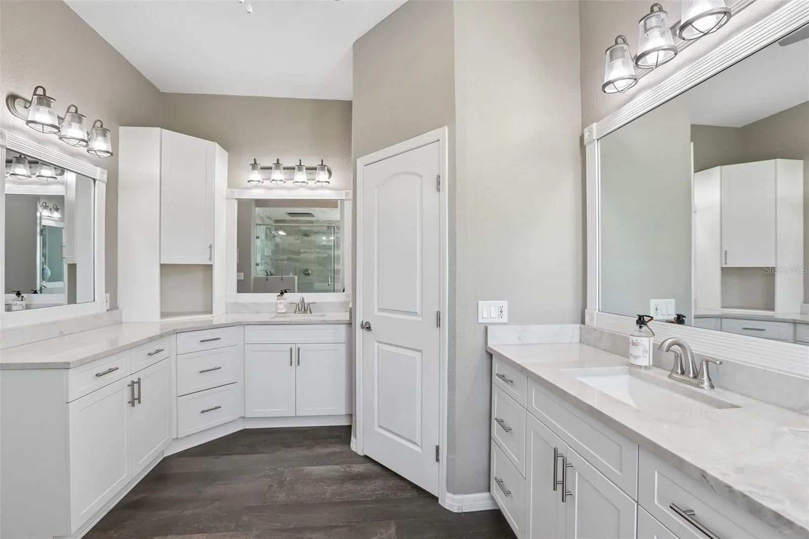 Primary Bathroom with dual vanities, makeup area,  soaking tub and new seamless shower glass