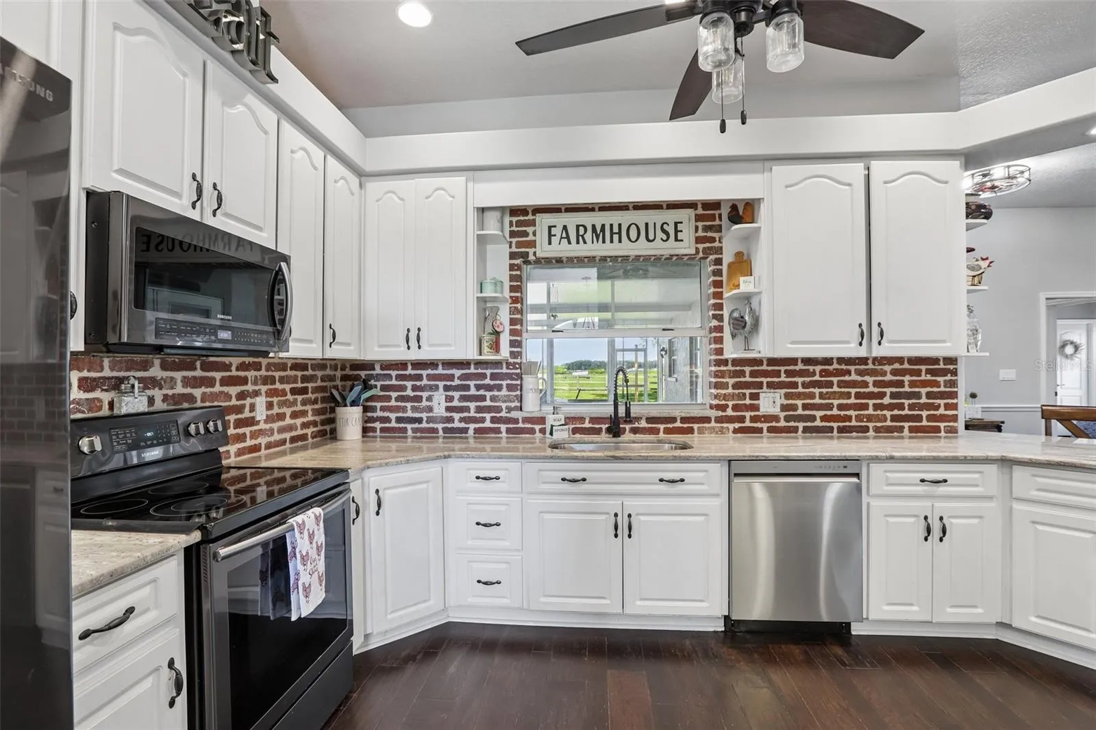 Kitchen with 42" cabinets, granite and brick backsplash