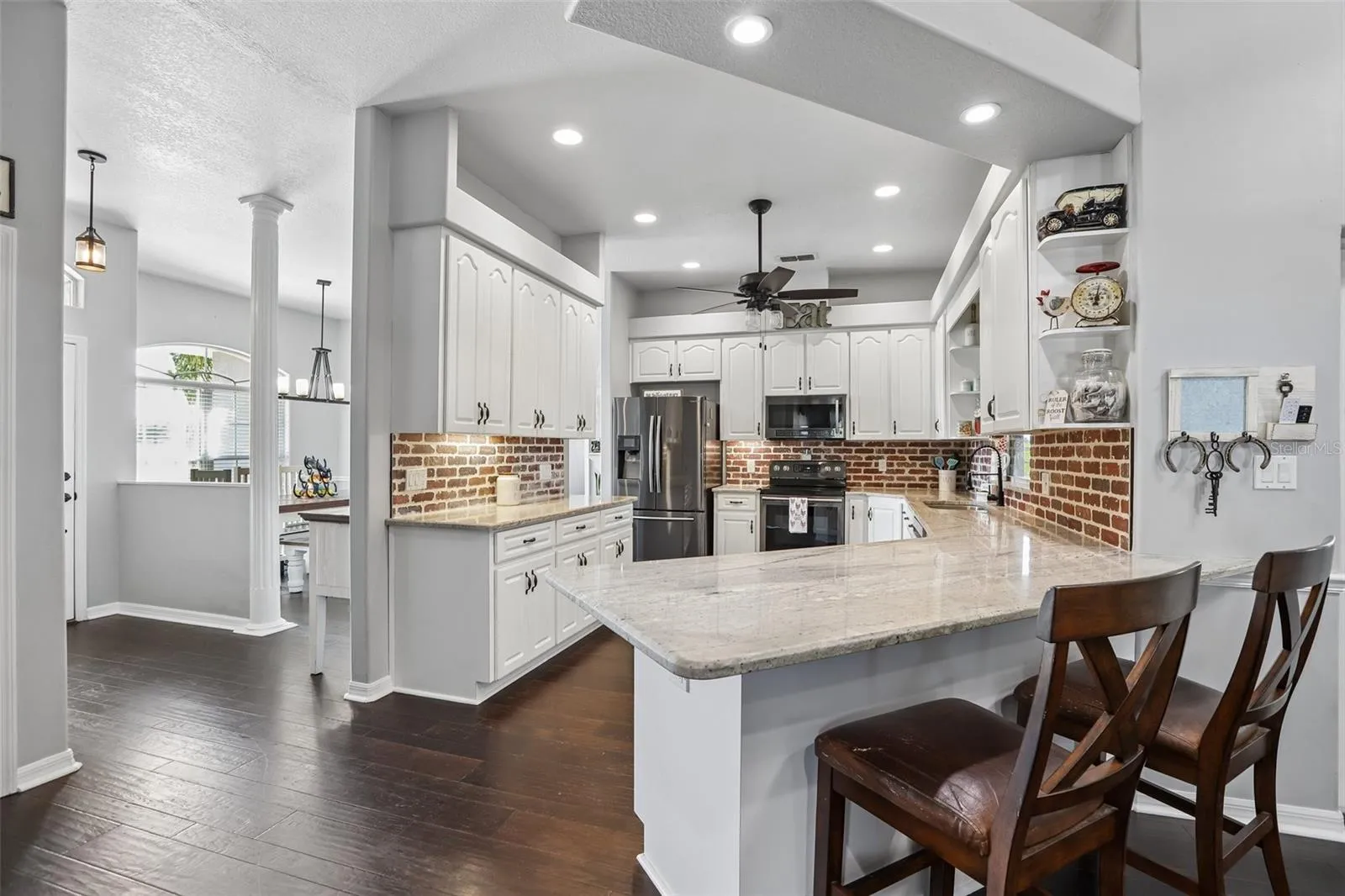 Kitchen with 42" cabinets, granite and brick backsplash