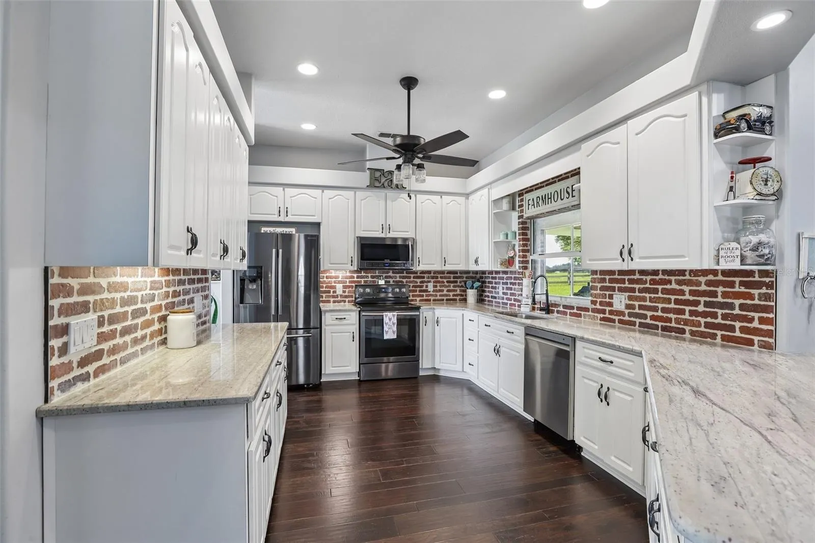 Kitchen with 42" cabinets, granite and brick backsplash