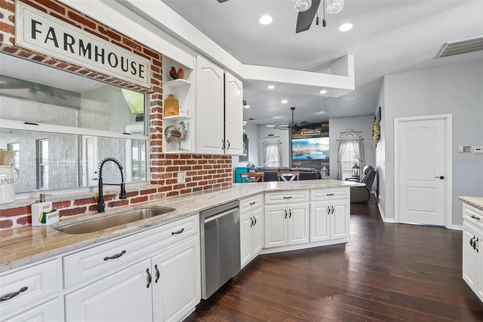 Kitchen with 42" cabinets, granite and brick backsplash