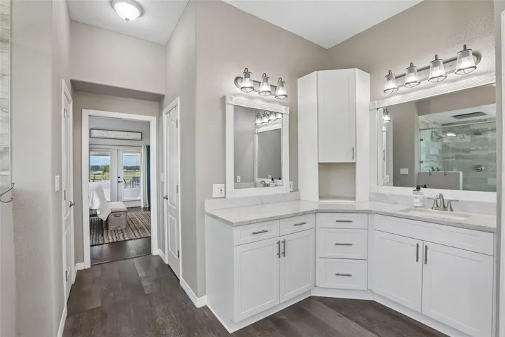 Primary Bathroom with dual vanities, makeup area,  soaking tub and new seamless shower glass