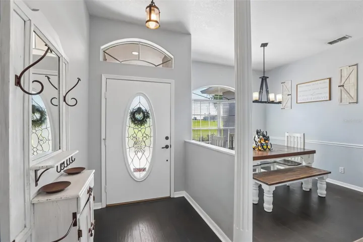 Foyer with view to the frond door and dining room