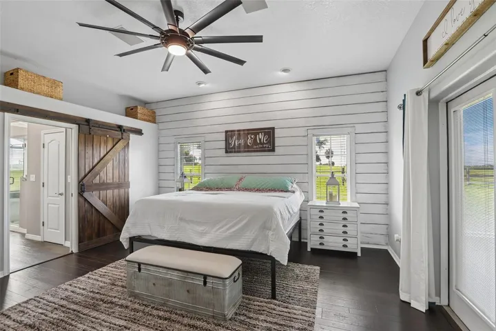 Primary Bedroom With Barn door to Primary Bathroom