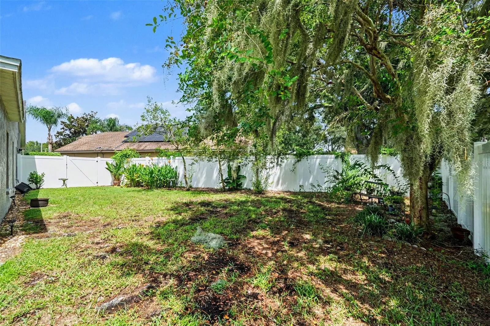 The other side of your massive yard! For plant lovers, pets and playing