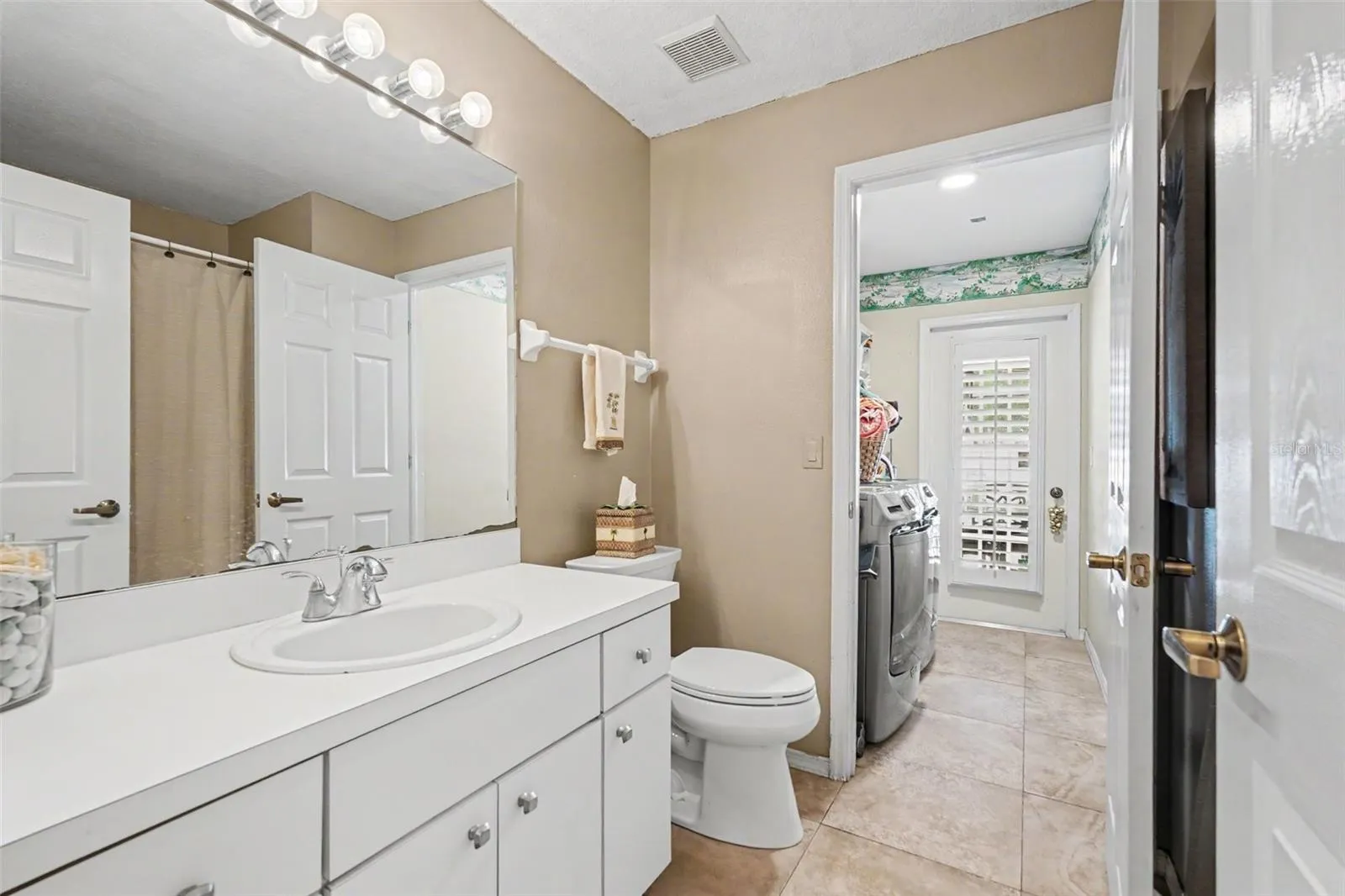 Bathroom 2 attaches to Laundry Room and opens to Lanai as Pool Bath