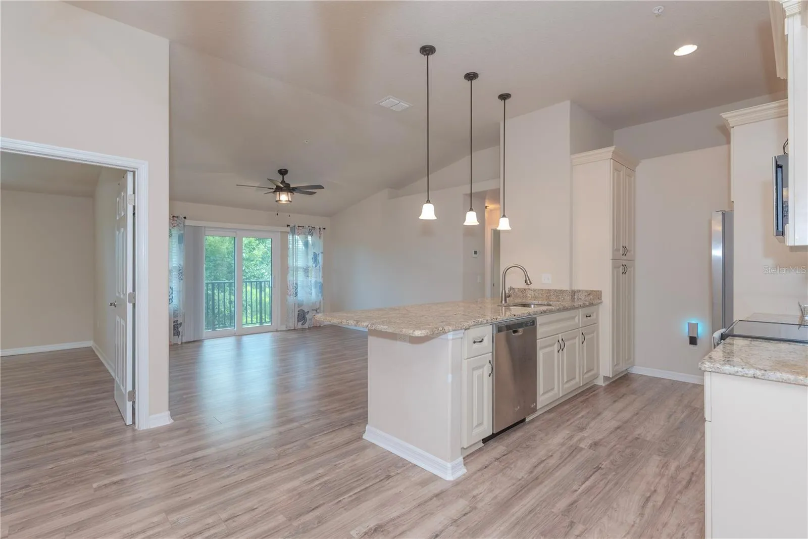Open floor plan with cathedral ceilings.