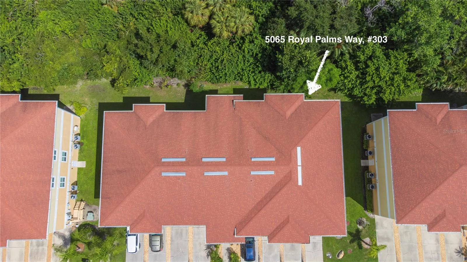 Top floor, right rear corner, overlooking trees.