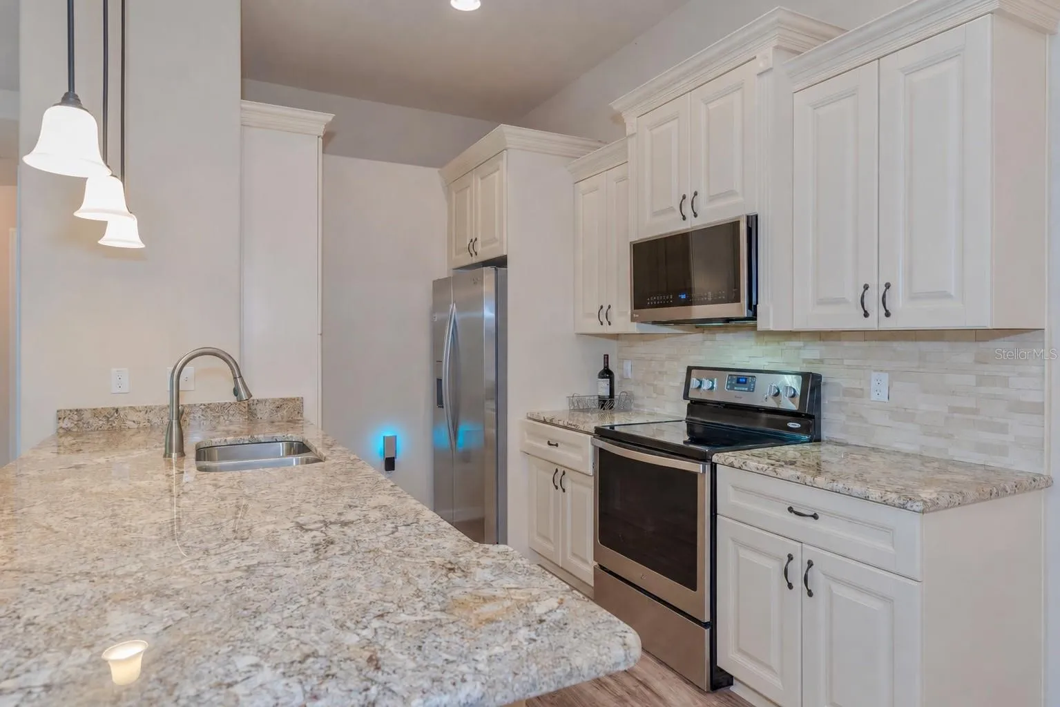 Kitchen with granite countertops.