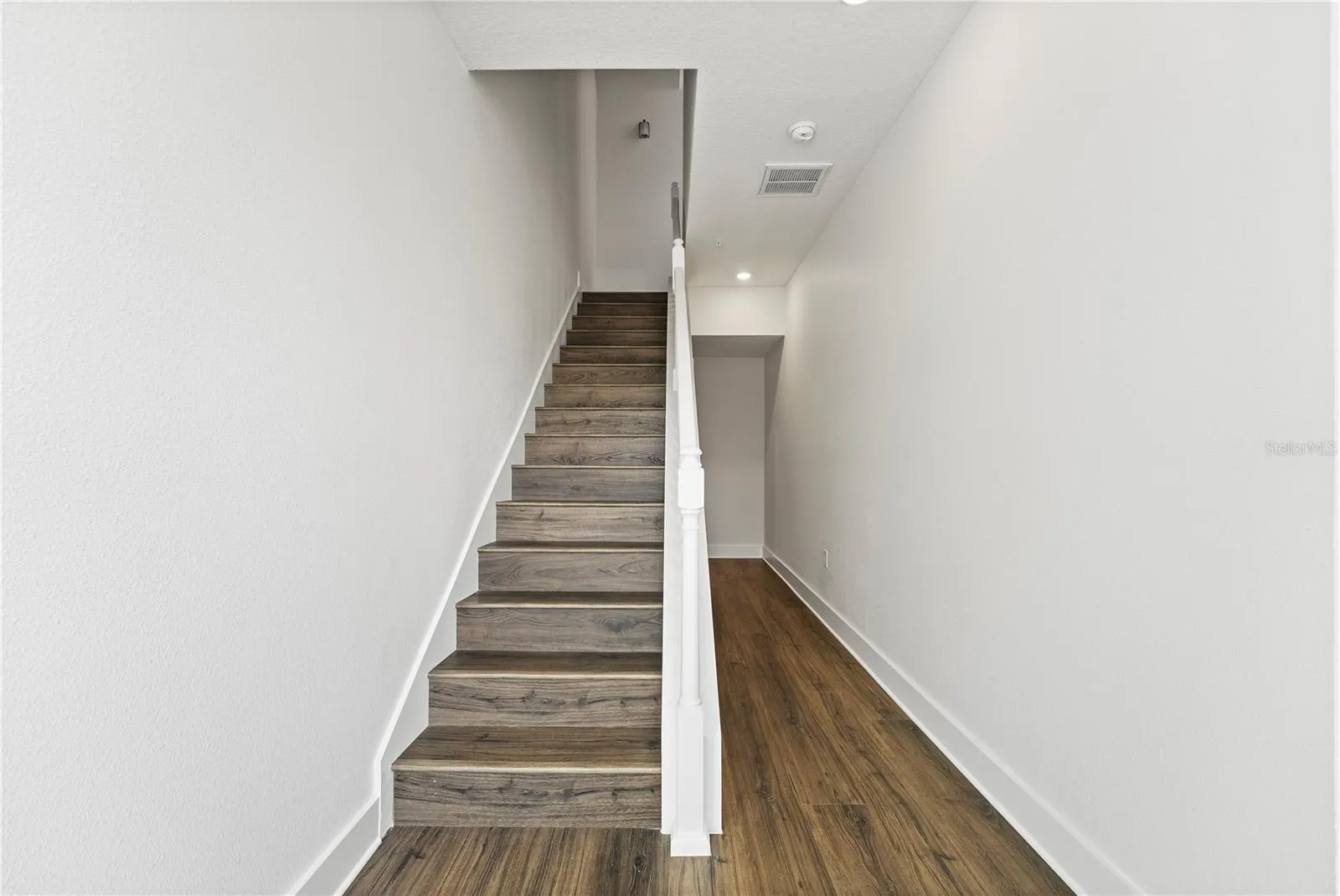 Hallway from the Courtyard and garage to the second floor (stairs to second floor)