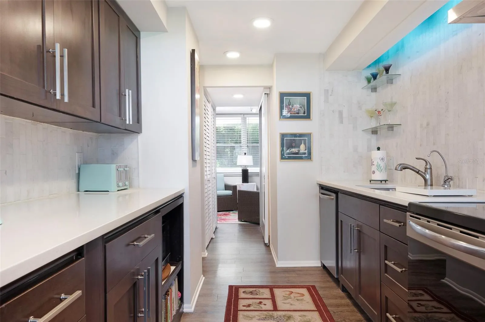 Pristine kitchen with multi-color track lighting
