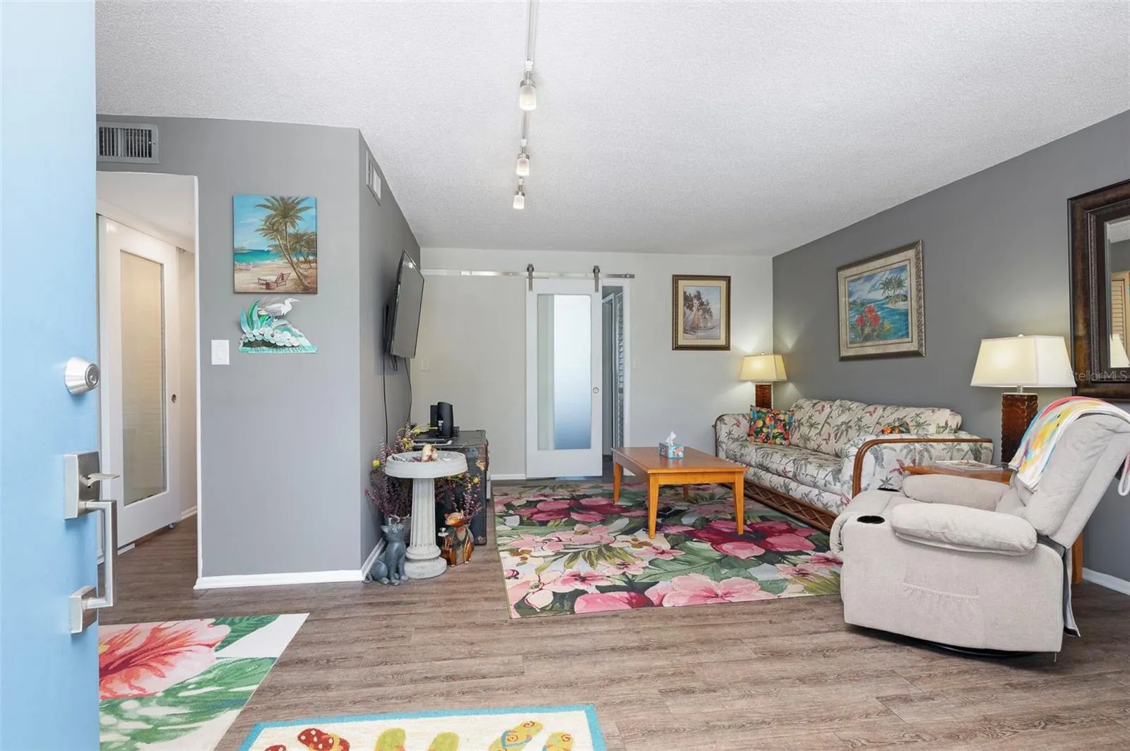 Living Room with Barndoor to Primary Bedroom