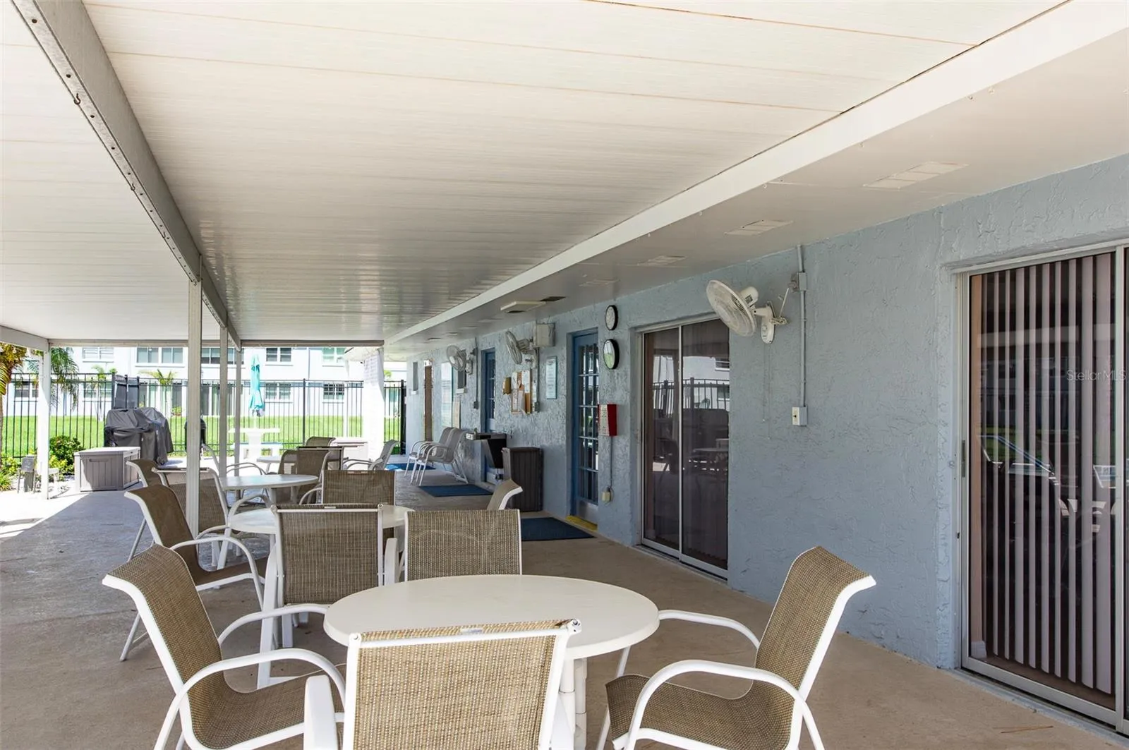 Covered patio to enjoy at the pool