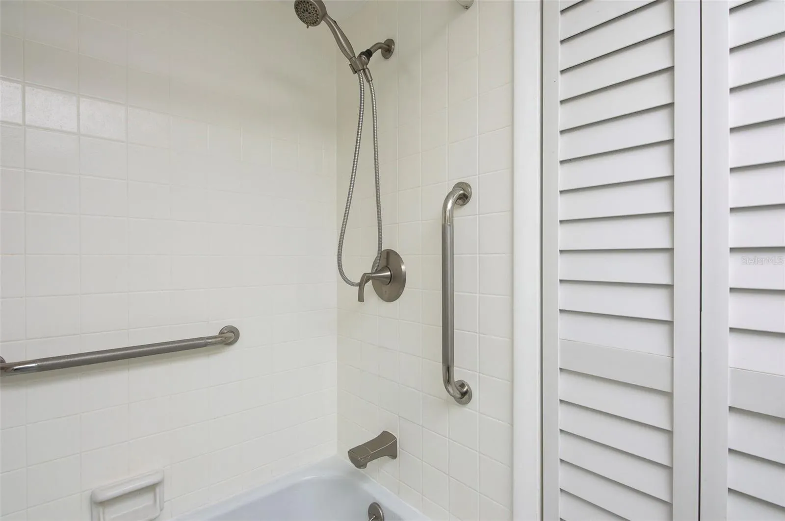 Step in tub/shower with bathroom grab bars