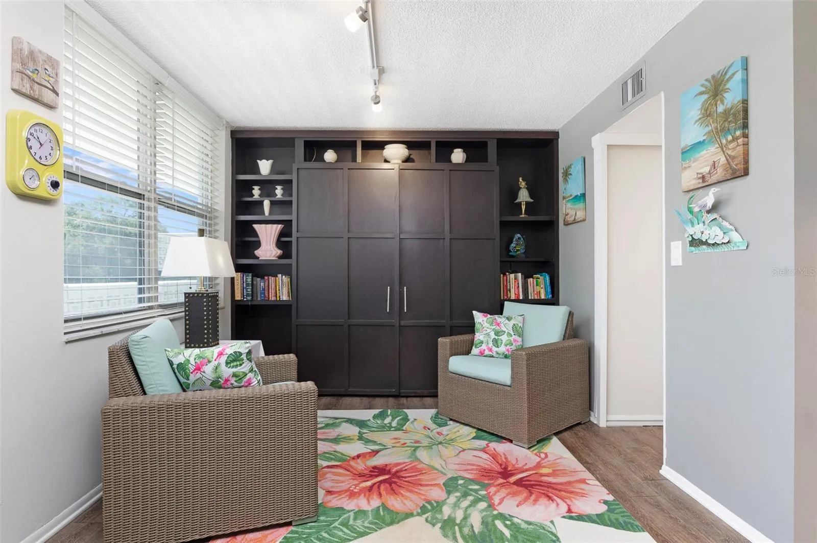 Built in bookcases with added treat.  A Queen Serta Murphy Bed for Guests.