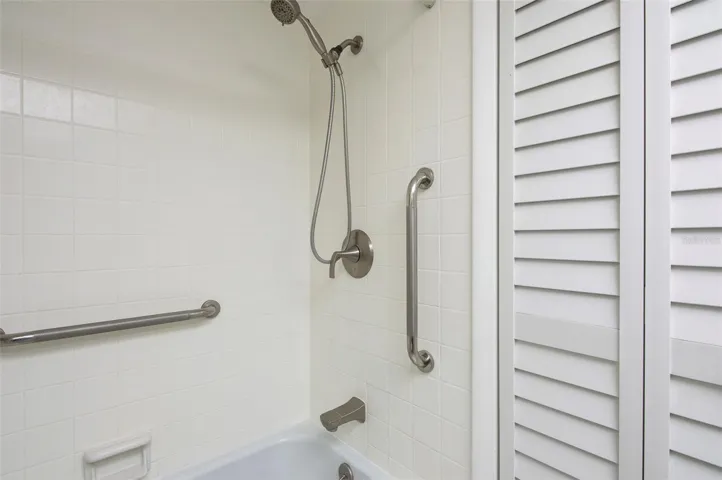 Step in tub/shower with bathroom grab bars