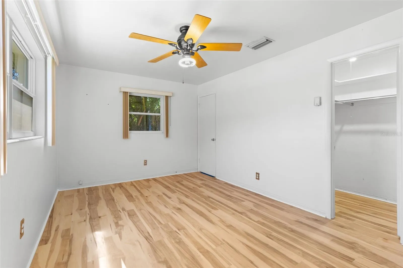 Primary bedroom with walk in closet
