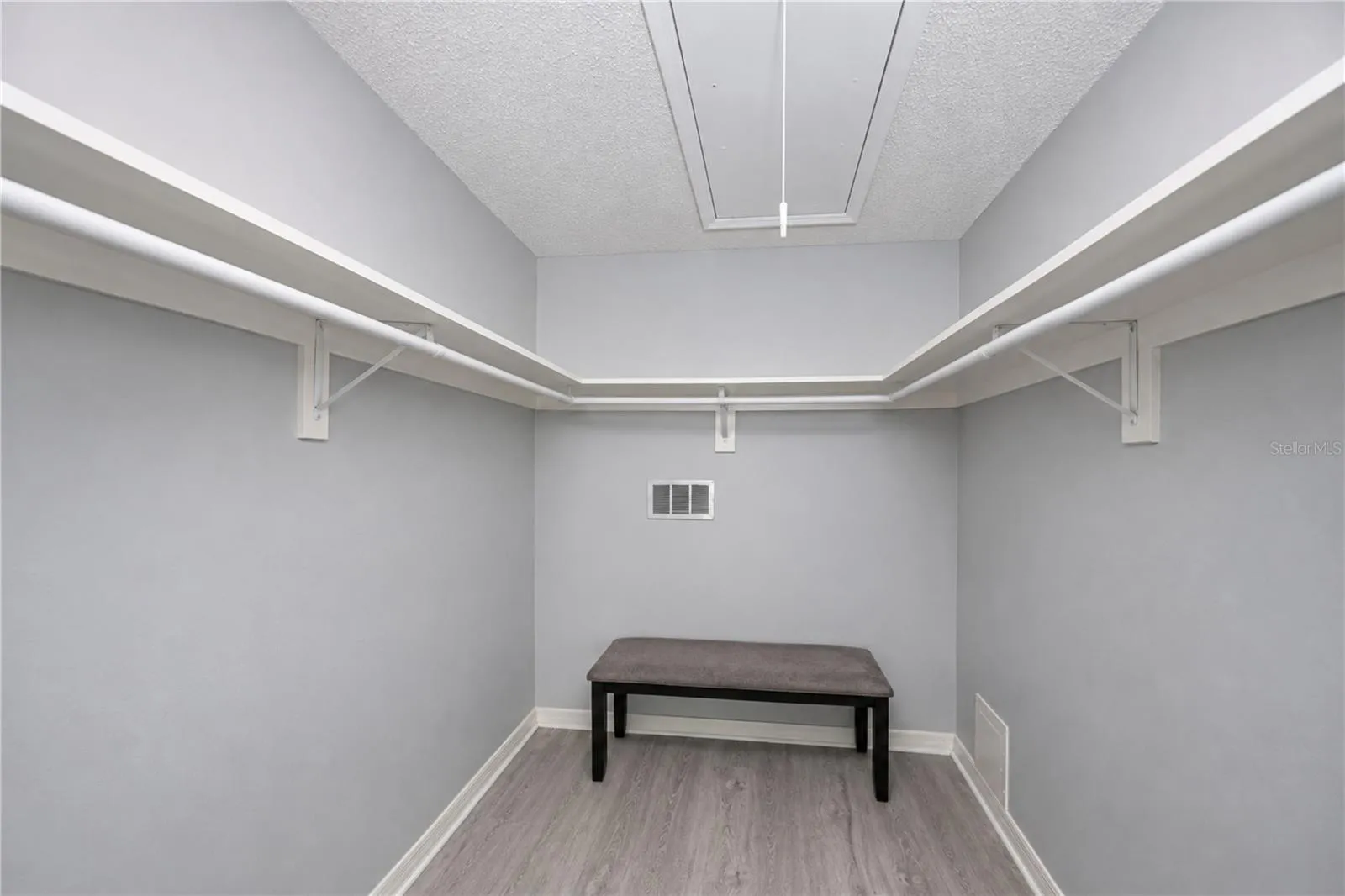 Primary bedroom walk-in closet