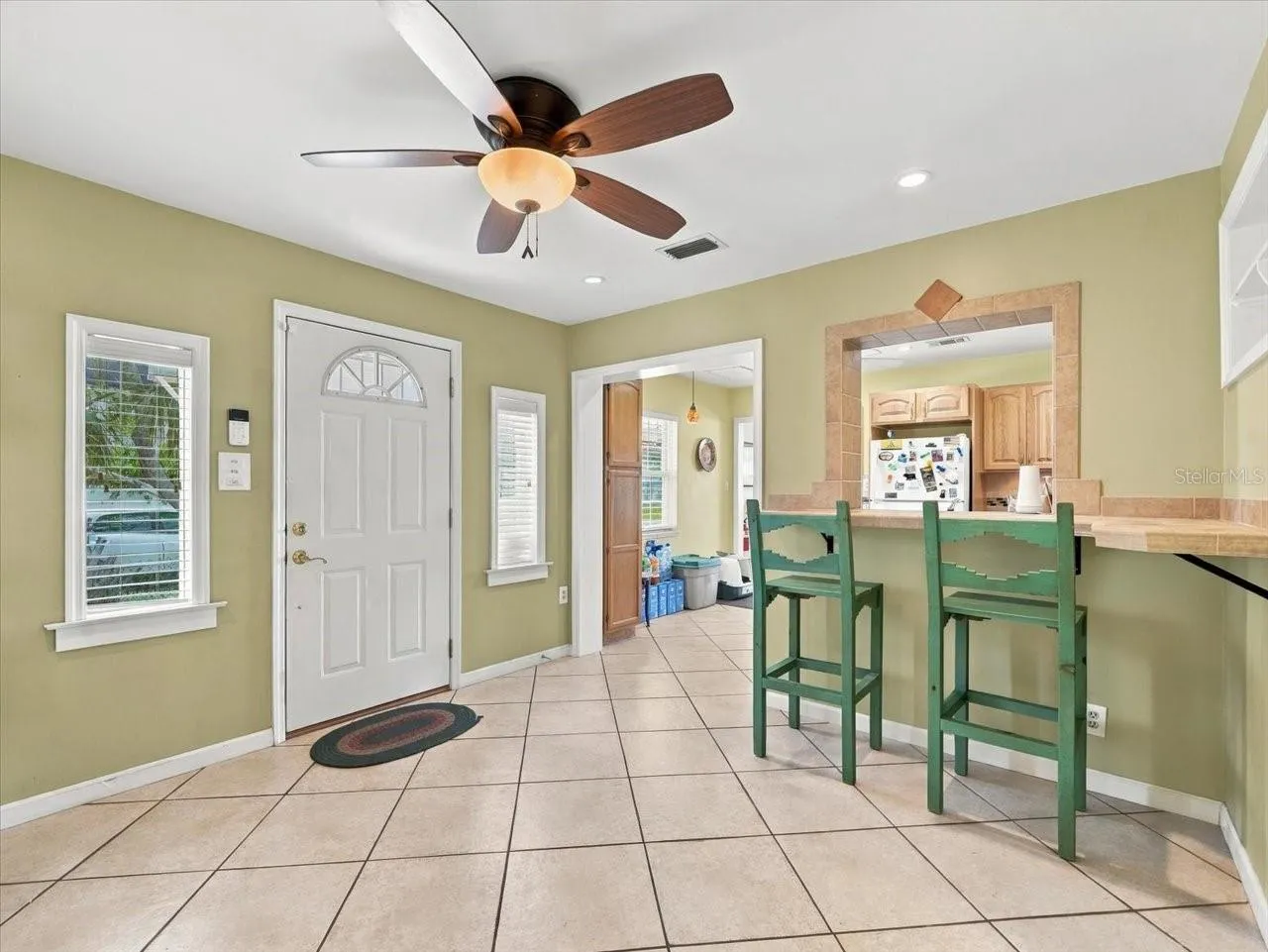 Breakfast bar off kitchen and side door.