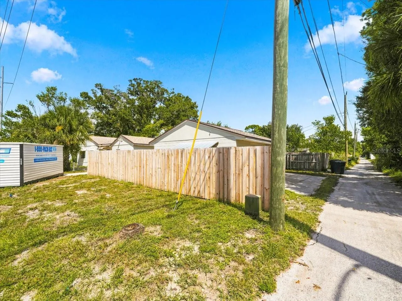 Large lot showing garage and house from corner Alleyway