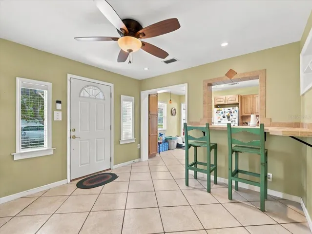 Breakfast bar off kitchen and side door.