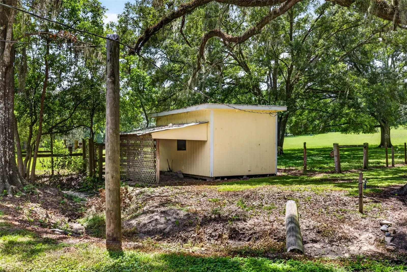 Detached storage shed with lean to storage
