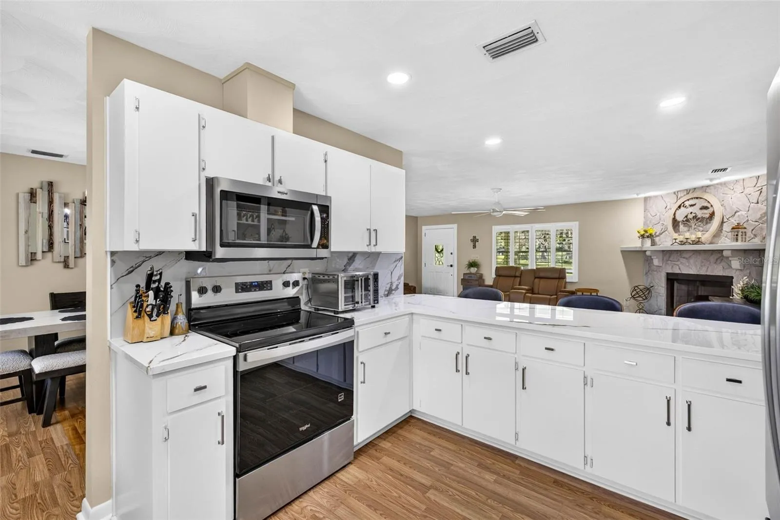 Large open kitchen with loads of cabinets