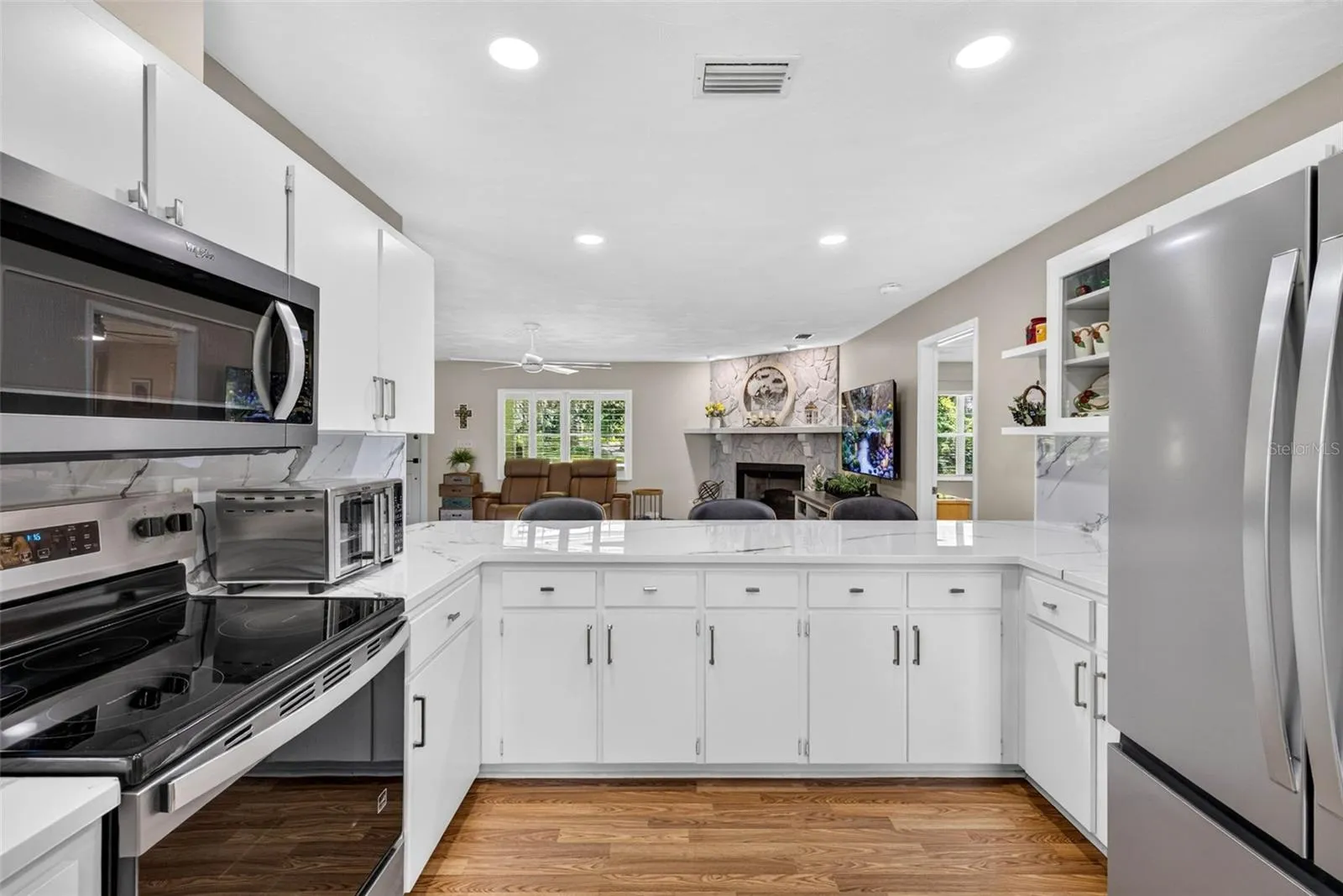 Large open kitchen with loads of cabinets