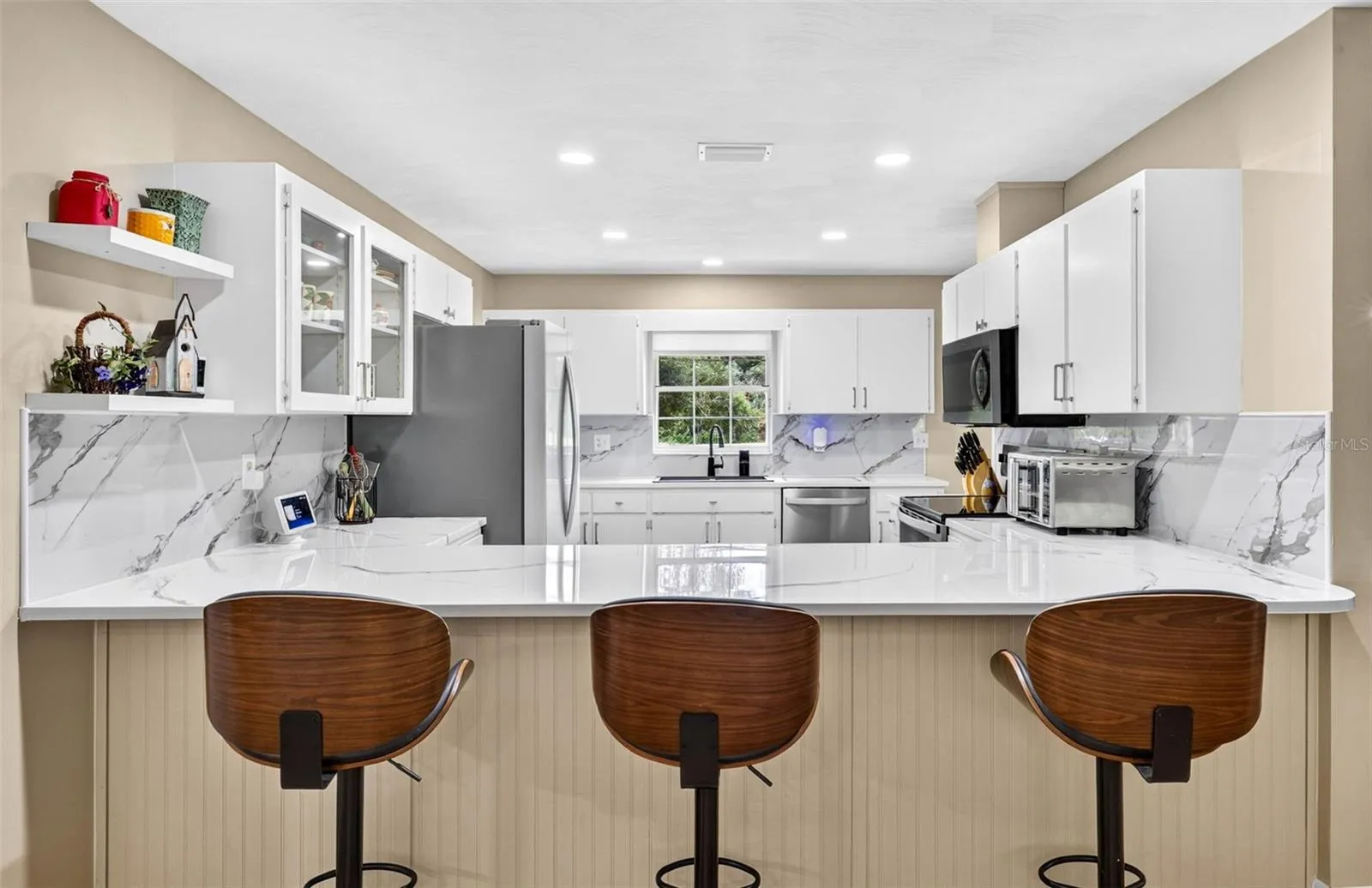 Large open kitchen with loads of cabinets