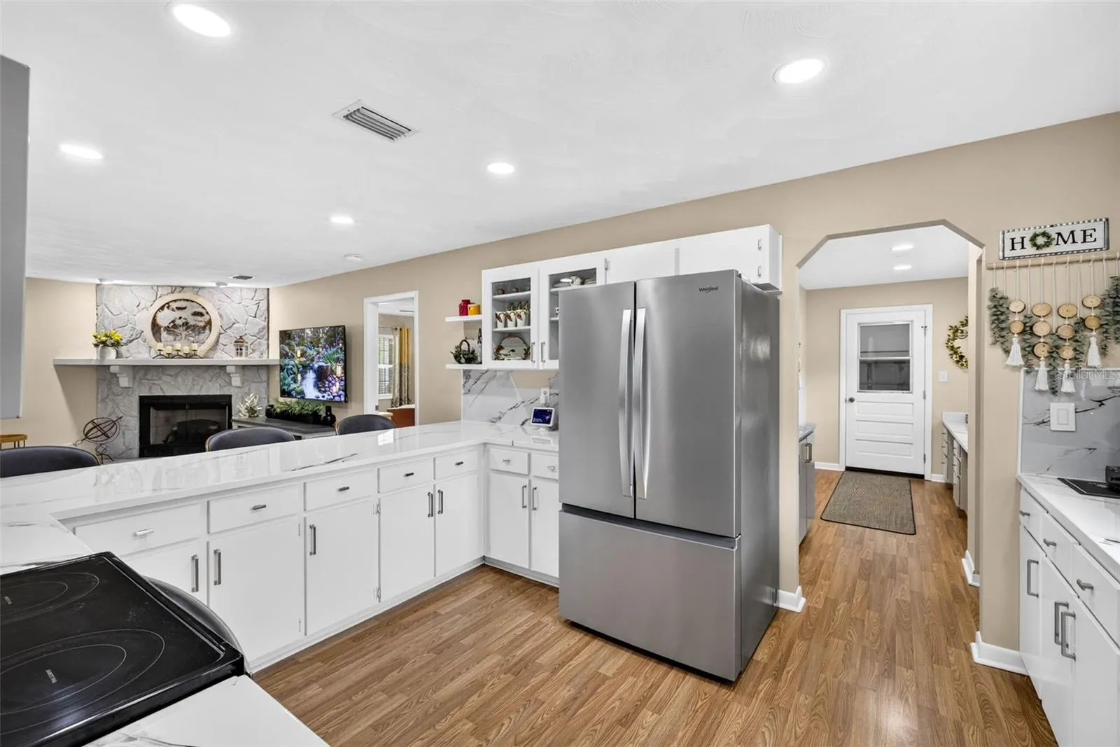 Large open kitchen with loads of cabinets