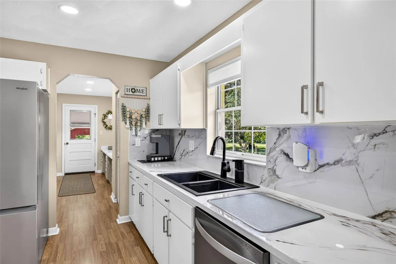 Large open kitchen with built in glass cutting board into the countertop