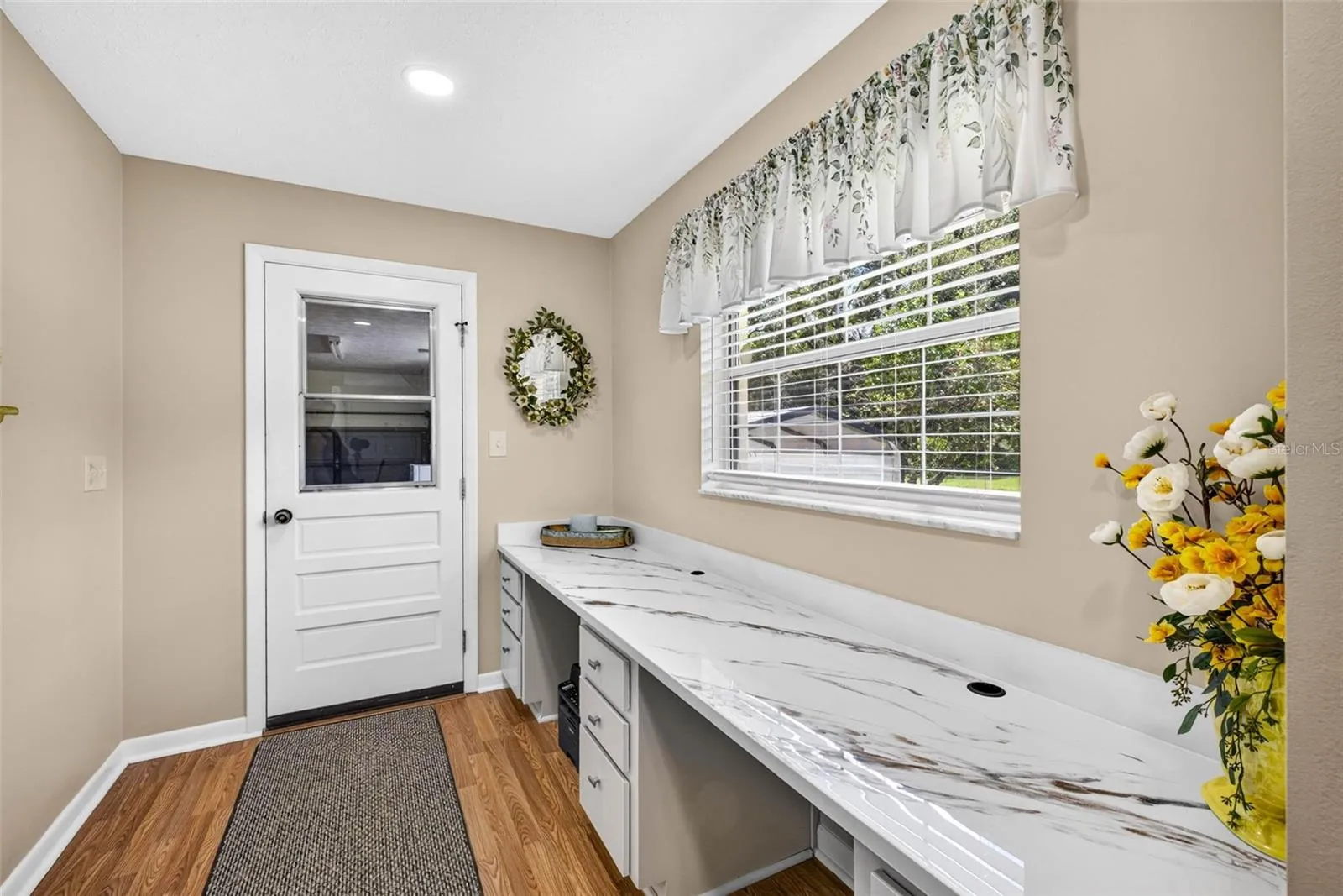 Mud room, loads of cabinet storage and countertops