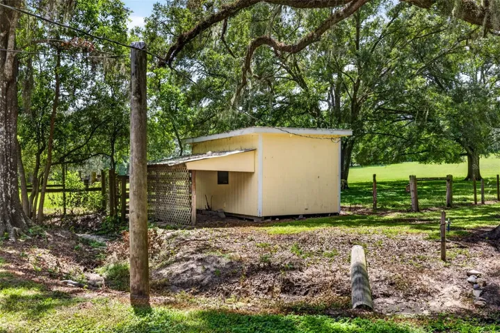 Detached storage shed with lean to storage