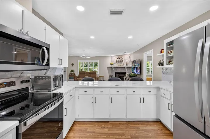 Large open kitchen with loads of cabinets