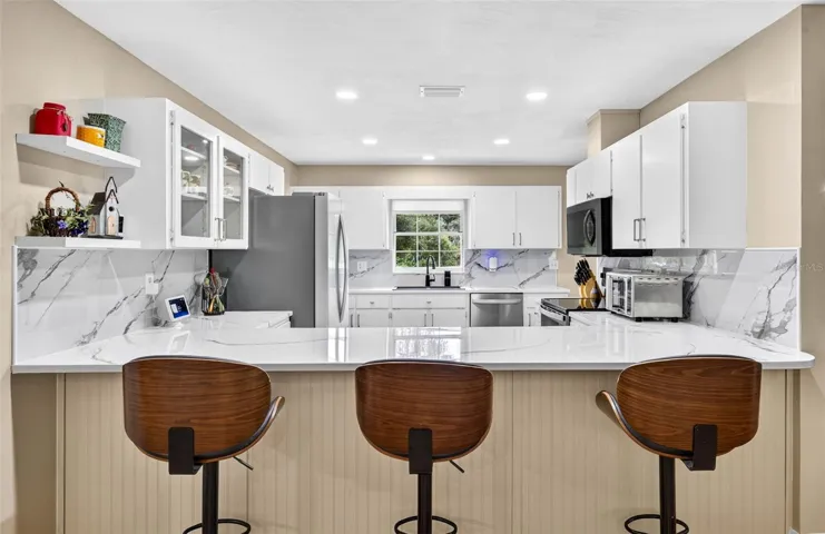 Large open kitchen with loads of cabinets
