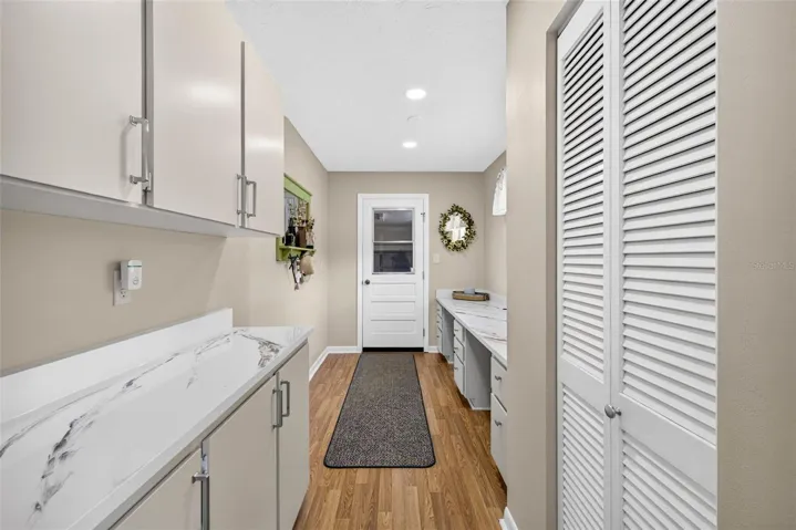 Mud room, loads of cabinet storage and countertops