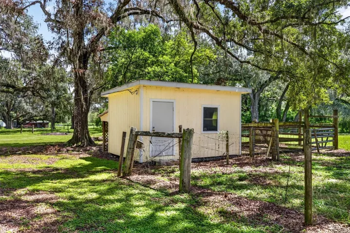 Detached storage shed with lean to storage
